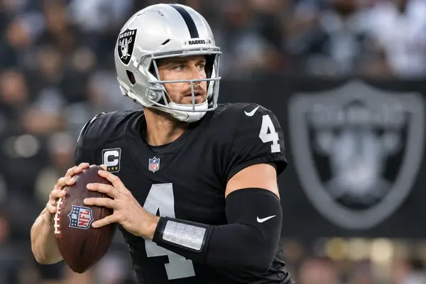 Derek Carr wearing a Las Vegas Raiders football uniform