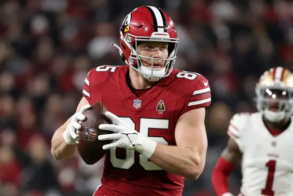 Trey McBride in action for the Arizona Cardinals wearing the number 85 jersey during an NFL game