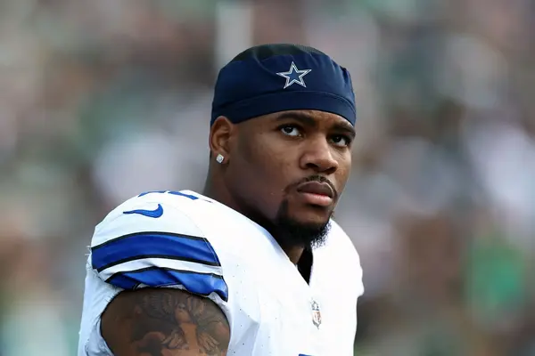 Dallas Cowboys linebacker Micah Parsons looking focused on the field in his white uniform.